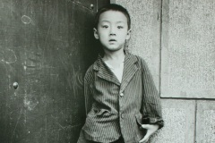 Boy in doorway, Hohhot, Inner Mongolia, China